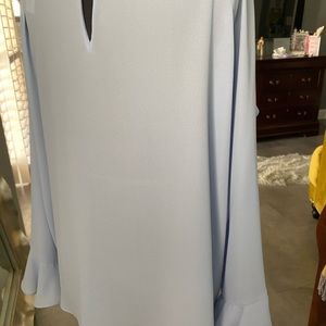 Women light blue top.